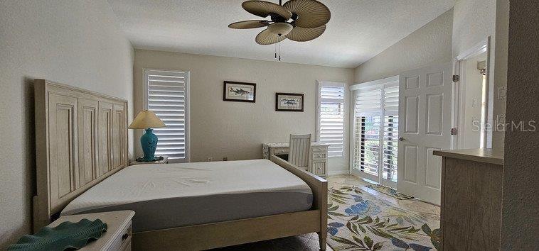 3920 Bal Harbor Boulevard, Unit E4 Punta Gorda, FL 33950 - Photo 17 of 24 a bedroom with a bed and a window