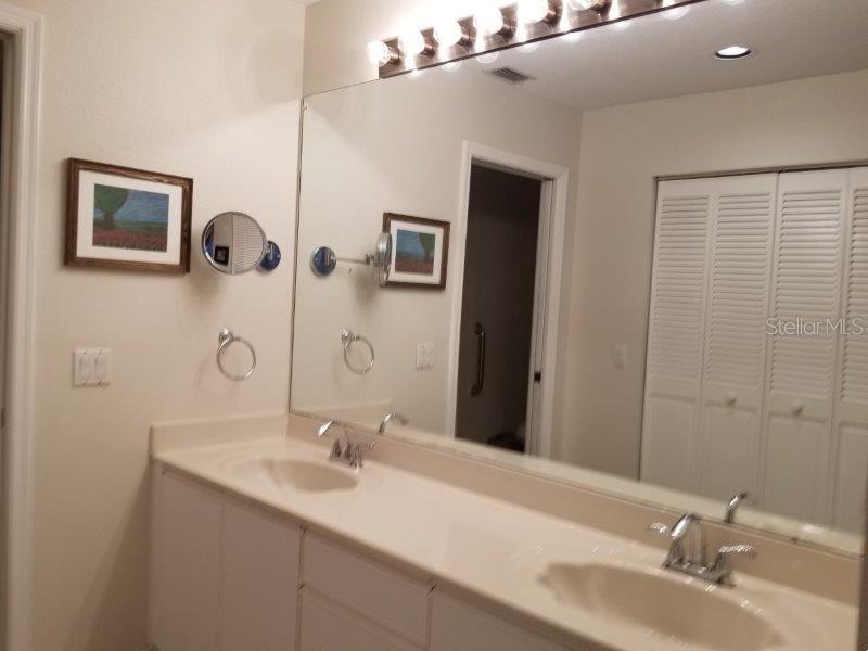 3920 Bal Harbor Boulevard, Unit E4 Punta Gorda, FL 33950 - Photo 21 of 24 a bathroom with a sink and a mirror
