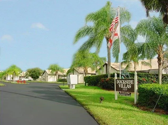 a view of a palm trees in front of a house