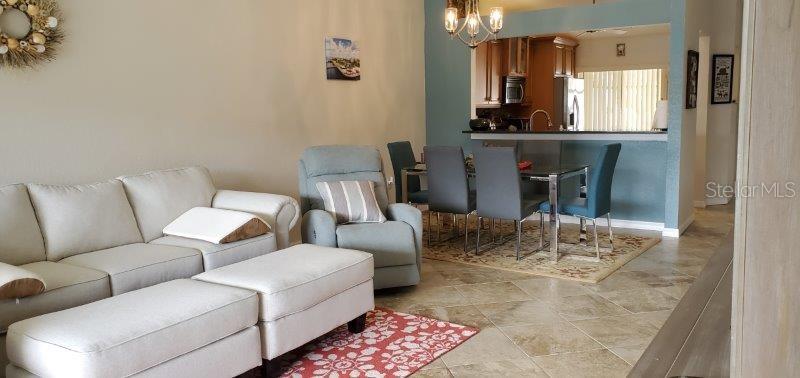 3920 Bal Harbor Boulevard, Unit E4 Punta Gorda, FL 33950 - Photo 10 of 24 a living room with furniture and wooden floor