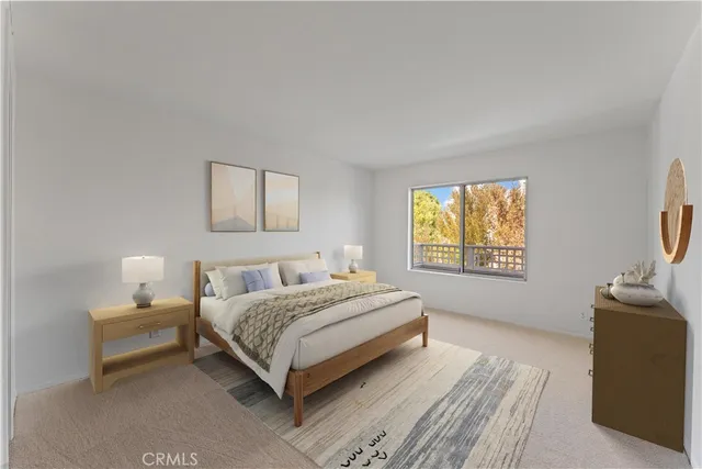 a spacious bedroom with a bed and a flat screen tv