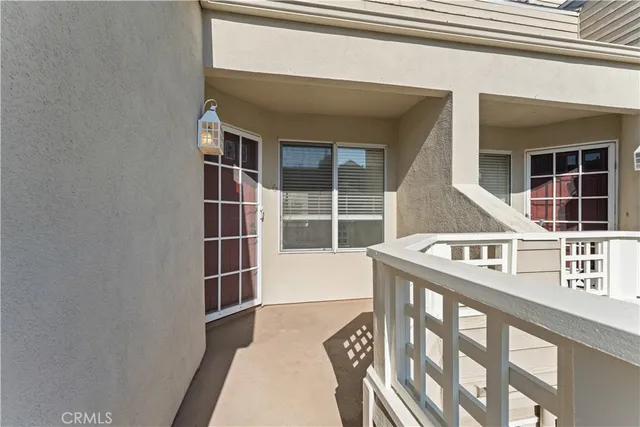 an aerial view of a house with swimming pool and seating space
