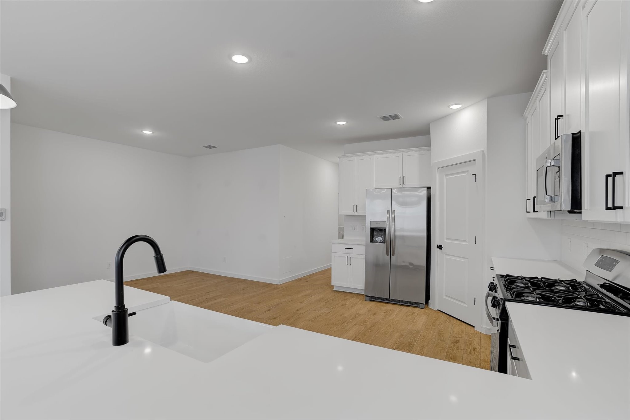 8438 Bay Rdg Circle Baytown, TX 77523 - Photo 11 of 44 a kitchen with a refrigerator and a sink