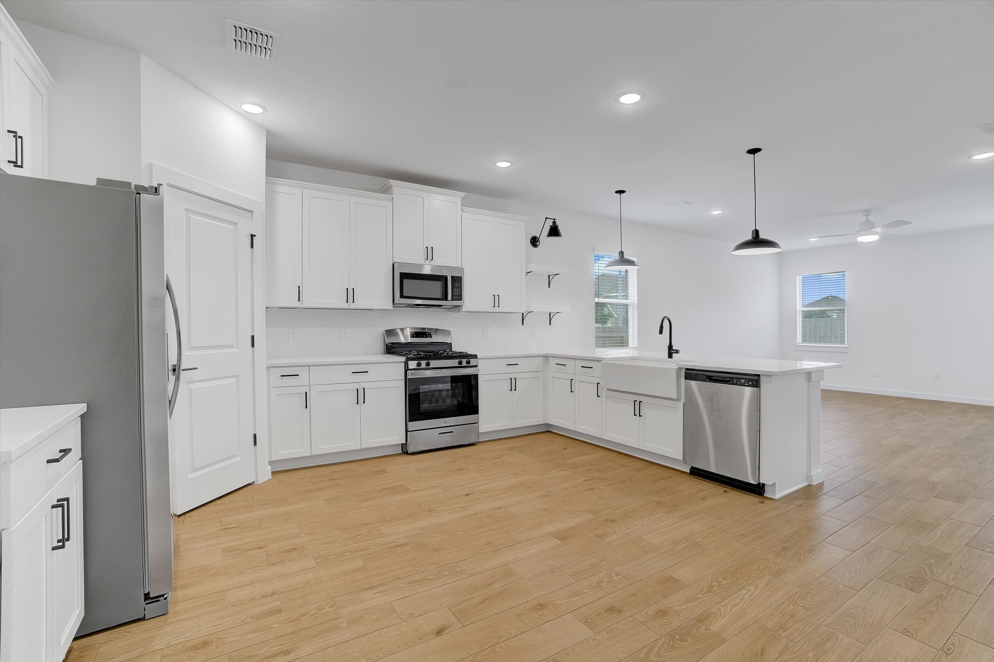 8438 Bay Rdg Circle Baytown, TX 77523 - Photo 6 of 44 a large kitchen with cabinets and stainless steel appliances