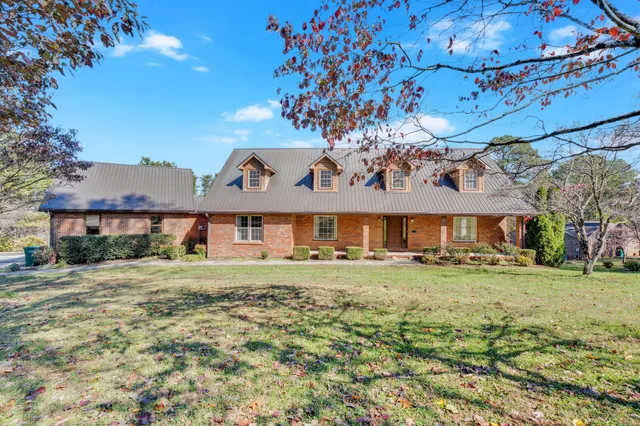 a view of a kitchen with a refrigerator and a sink