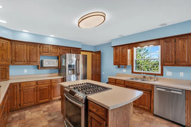 a view of a room with table and chairs