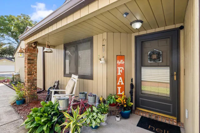a front view of a house with outdoor seating