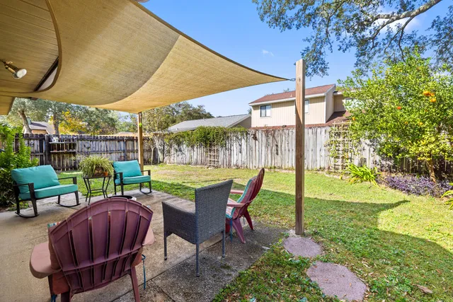 a view of an chairs and table in the patio
