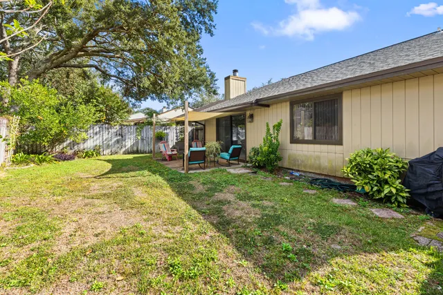 a view of a backyard with a garden and plants