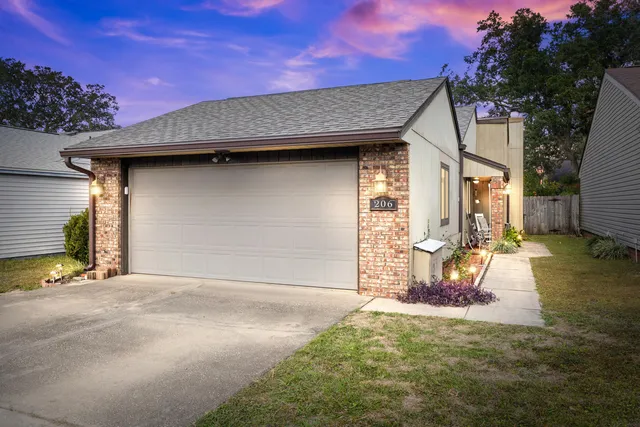 a backyard of a house with yard and outdoor seating