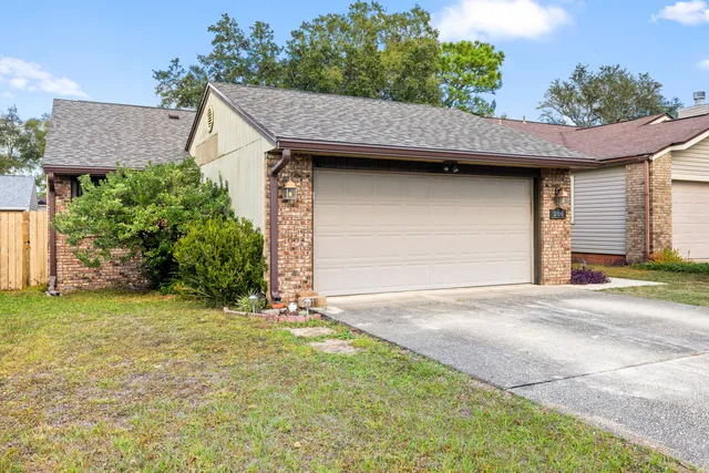 a backyard of a house with plants and trees