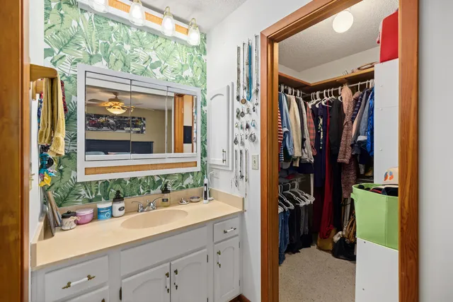 a bathroom with a double vanity sink and a mirror