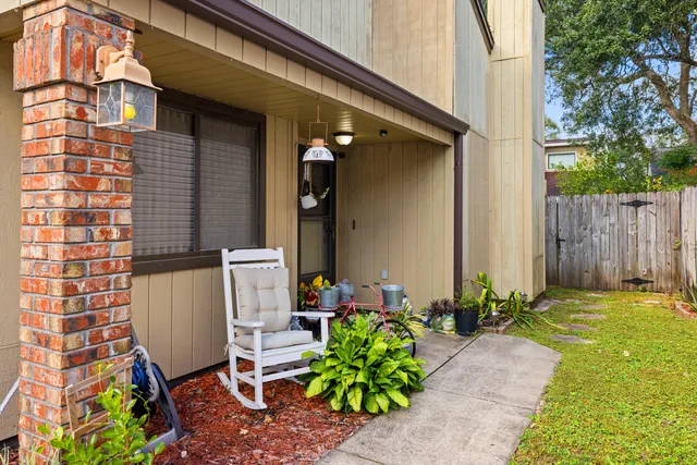 a backyard of a house with outdoor seating