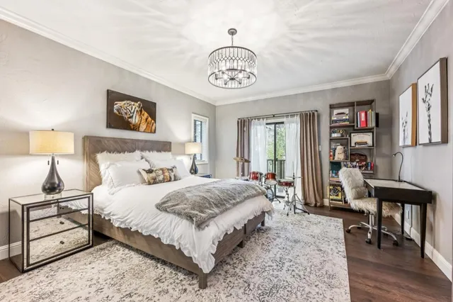 a bedroom with a bed and a table in it