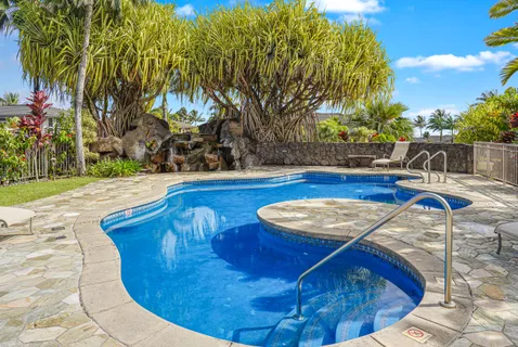 a view of a swimming pool with a patio