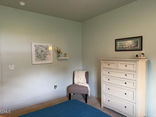 574 East Ridge Avenue Liberty, NC 27298 - Photo 19 of 28 a room with painting on the wall and a dresser
