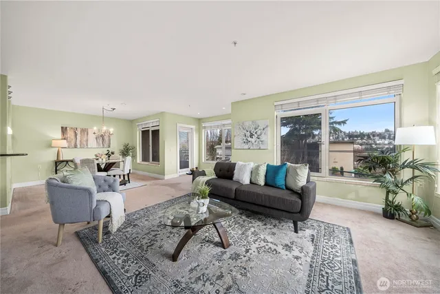 a spacious bedroom with a bed and a chandelier