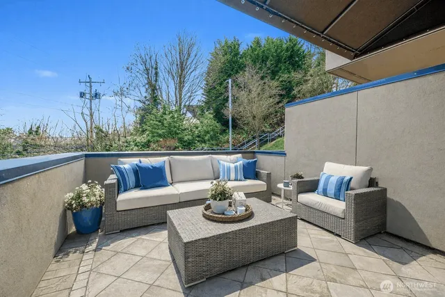 a bathroom with a granite countertop sink mirror and bathtub