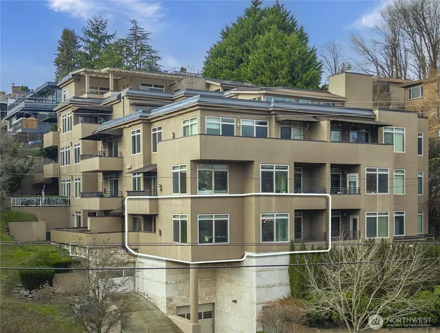 a kitchen with stainless steel appliances wooden cabinets and a sink