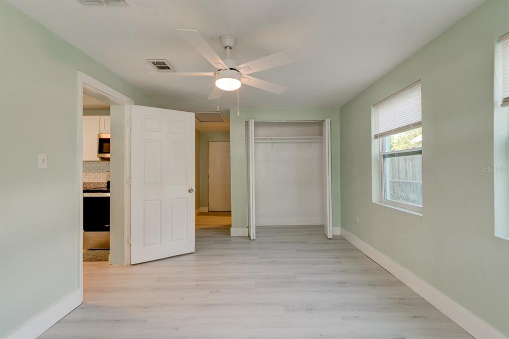 404 Adele Street Edgewater, FL 32132 - Photo 16 of 23 an empty room with closet and a window