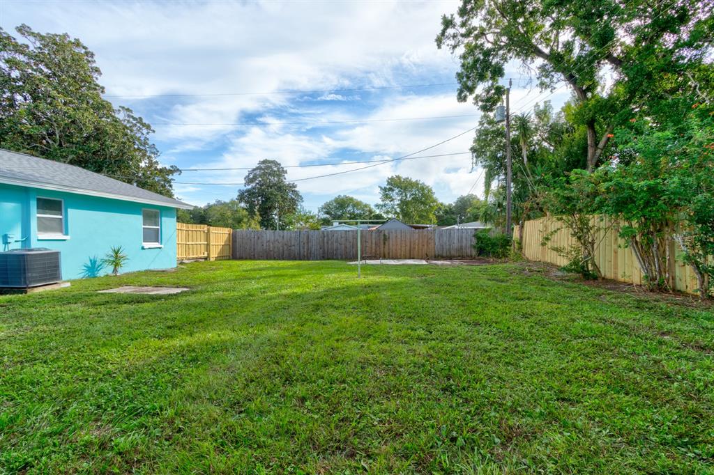 404 Adele Street Edgewater, FL 32132 - Photo 22 of 23 a view of a backyard with a garden