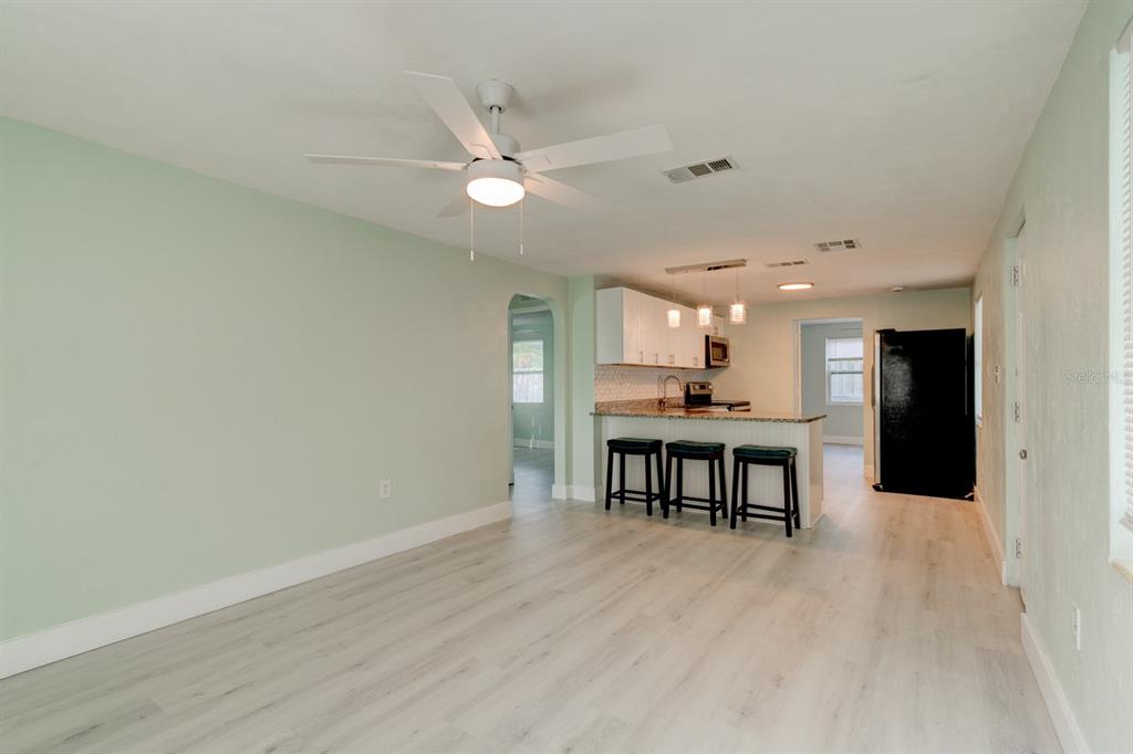 404 Adele Street Edgewater, FL 32132 - Photo 4 of 23 a view of dining room with furniture and wooden floor