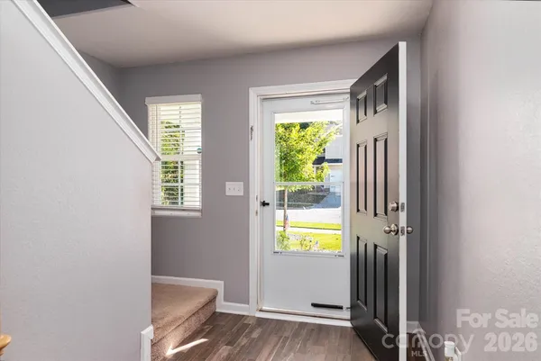 a view of an entryway and a livingroom