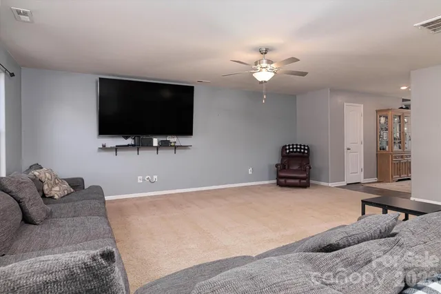 a kitchen with granite countertop cabinets stainless steel appliances a sink and a window