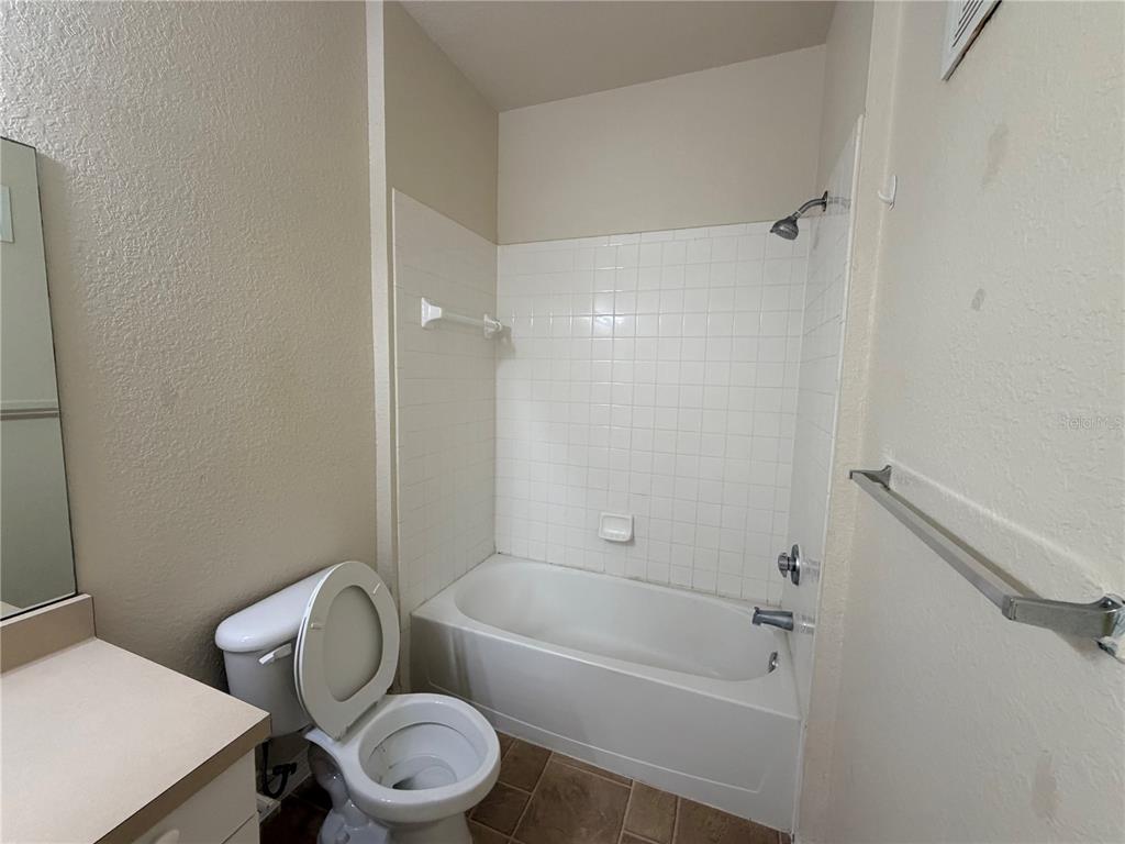 3561 Conroy Road, Unit 231 Orlando, FL 32839 - Photo 11 of 19 a bathroom with a toilet and a bathtub