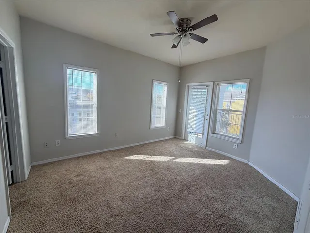 a view of empty room with windows