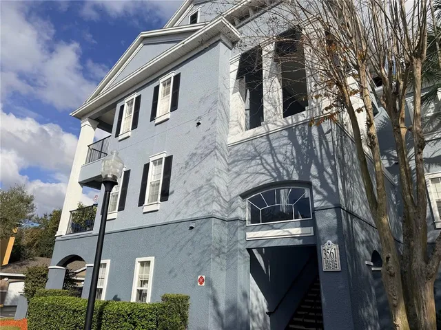 a view of a building with a yard