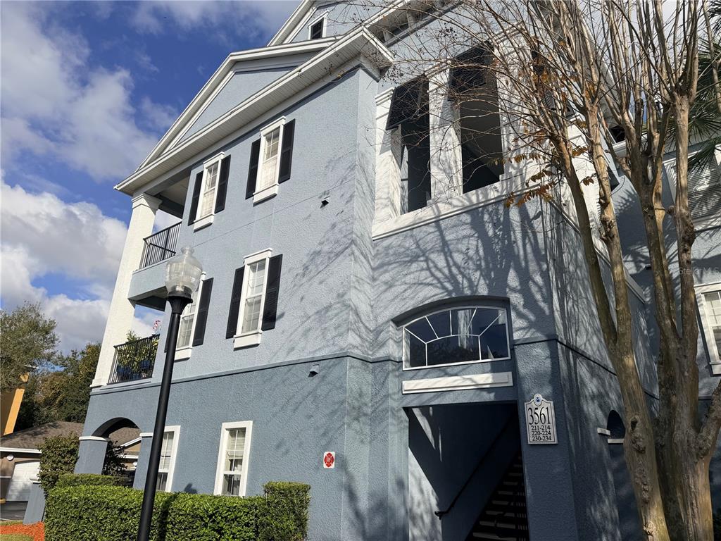 3561 Conroy Road, Unit 231 Orlando, FL 32839 - Photo 2 of 19 a view of a building with a yard