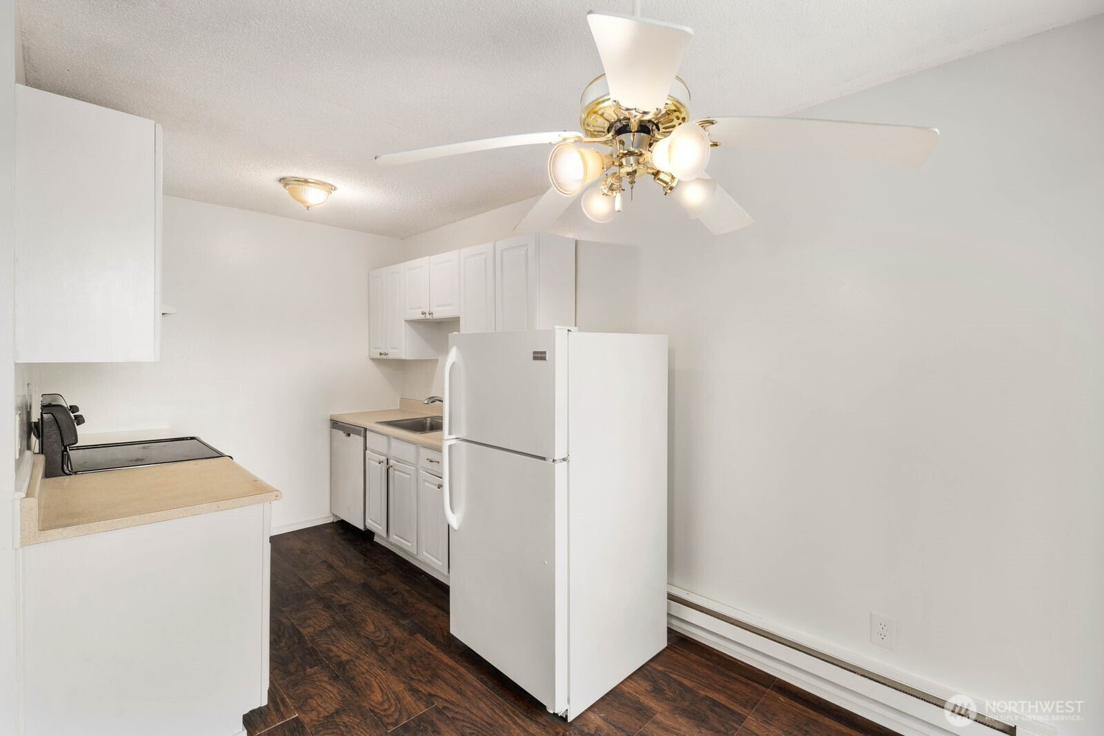 9623 South 248th Street, Unit C8 Kent, WA 98030 - Photo 13 of 37 a kitchen with white cabinets and white appliances