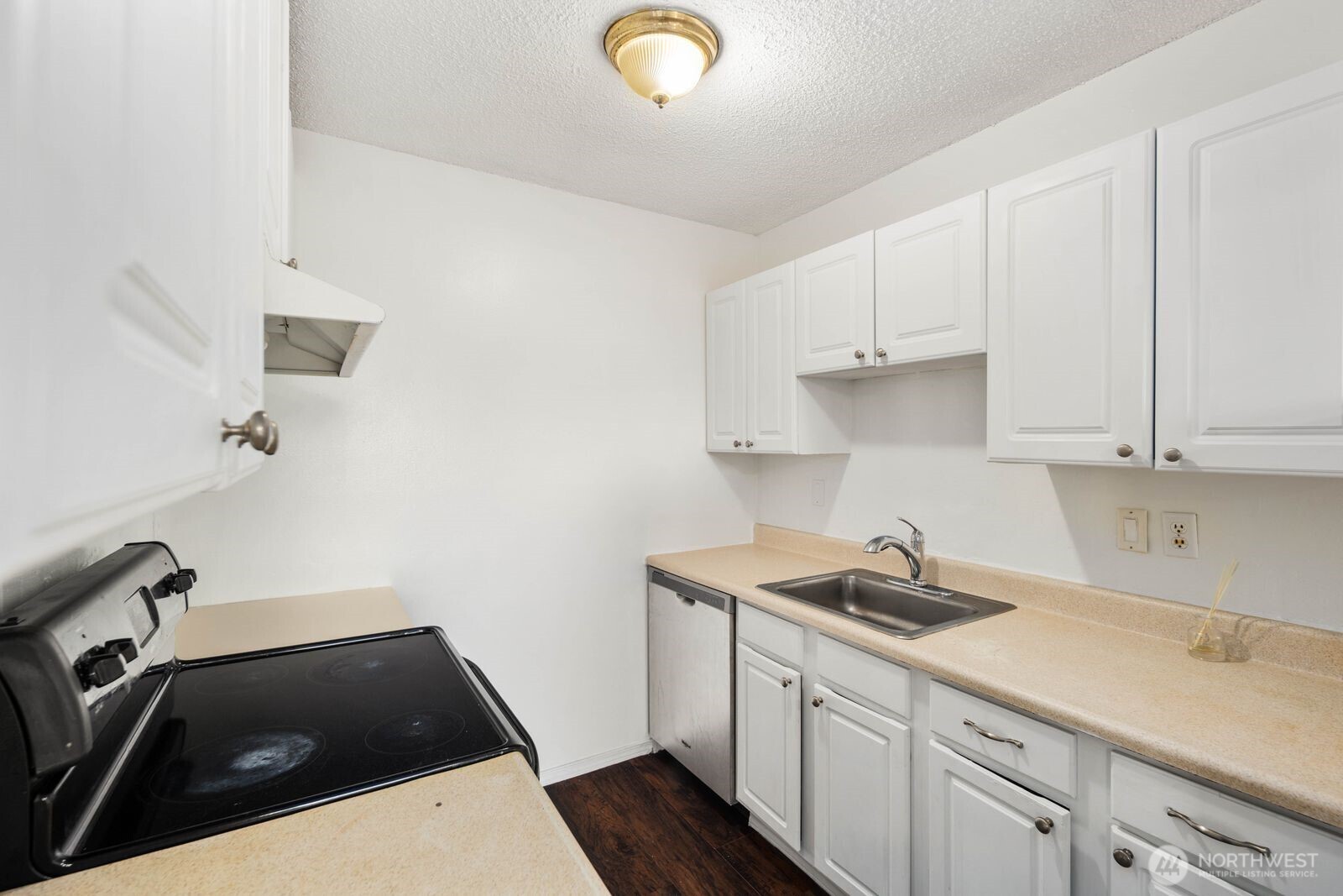 9623 South 248th Street, Unit C8 Kent, WA 98030 - Photo 15 of 37 a kitchen with a sink and cabinets
