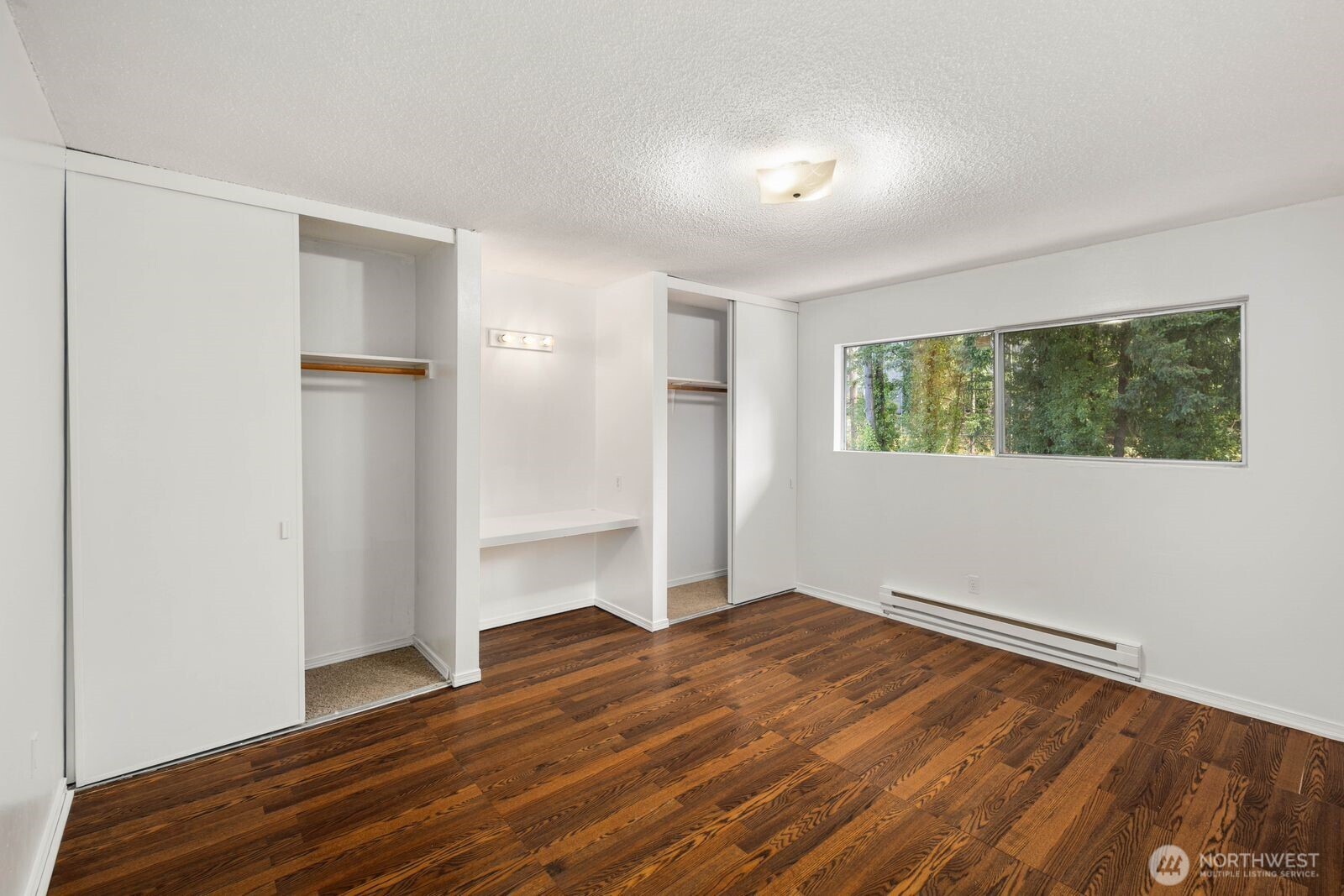 9623 South 248th Street, Unit C8 Kent, WA 98030 - Photo 16 of 37 a view of empty room with wooden floor and fan