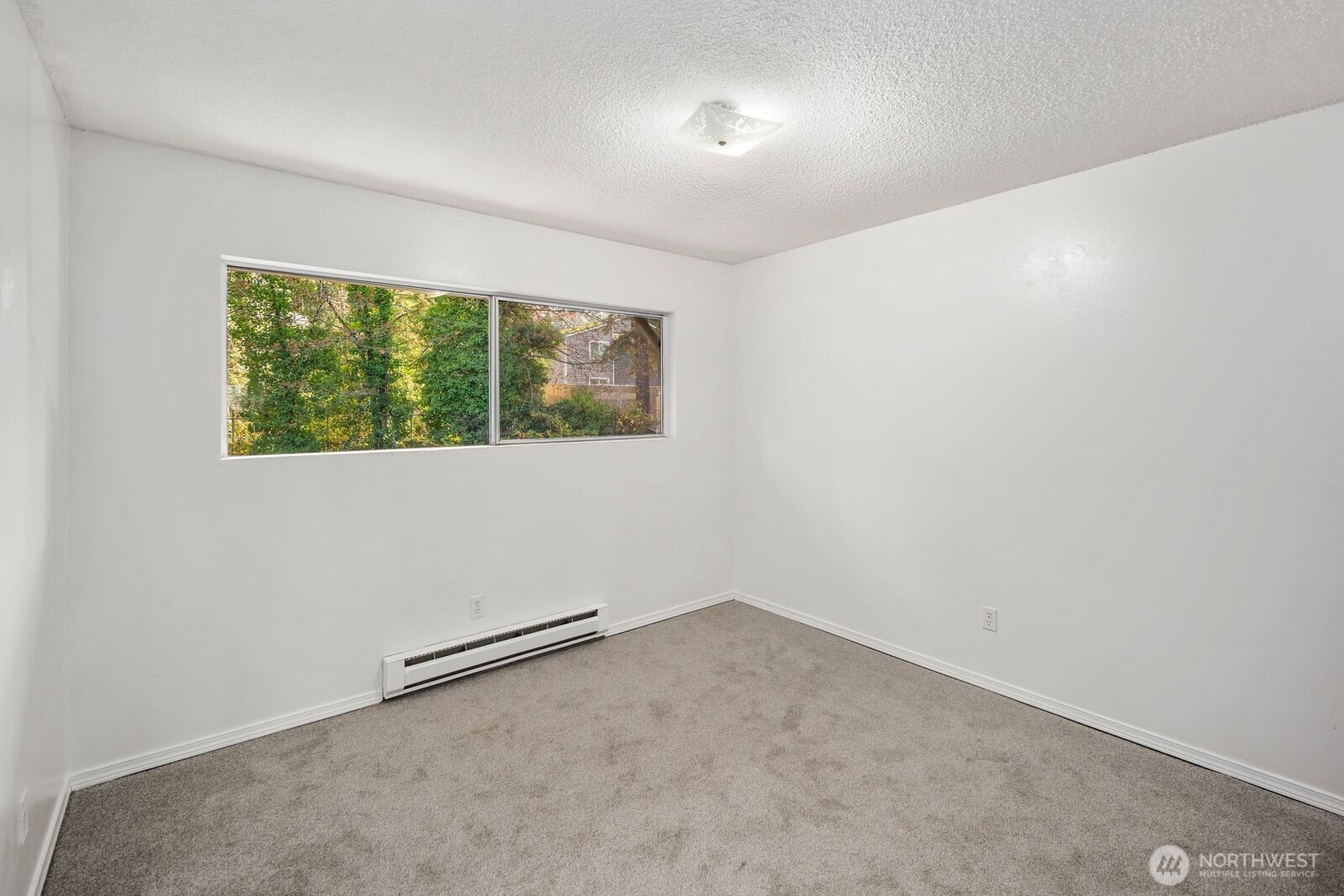 9623 South 248th Street, Unit C8 Kent, WA 98030 - Photo 18 of 37 an empty room with a window