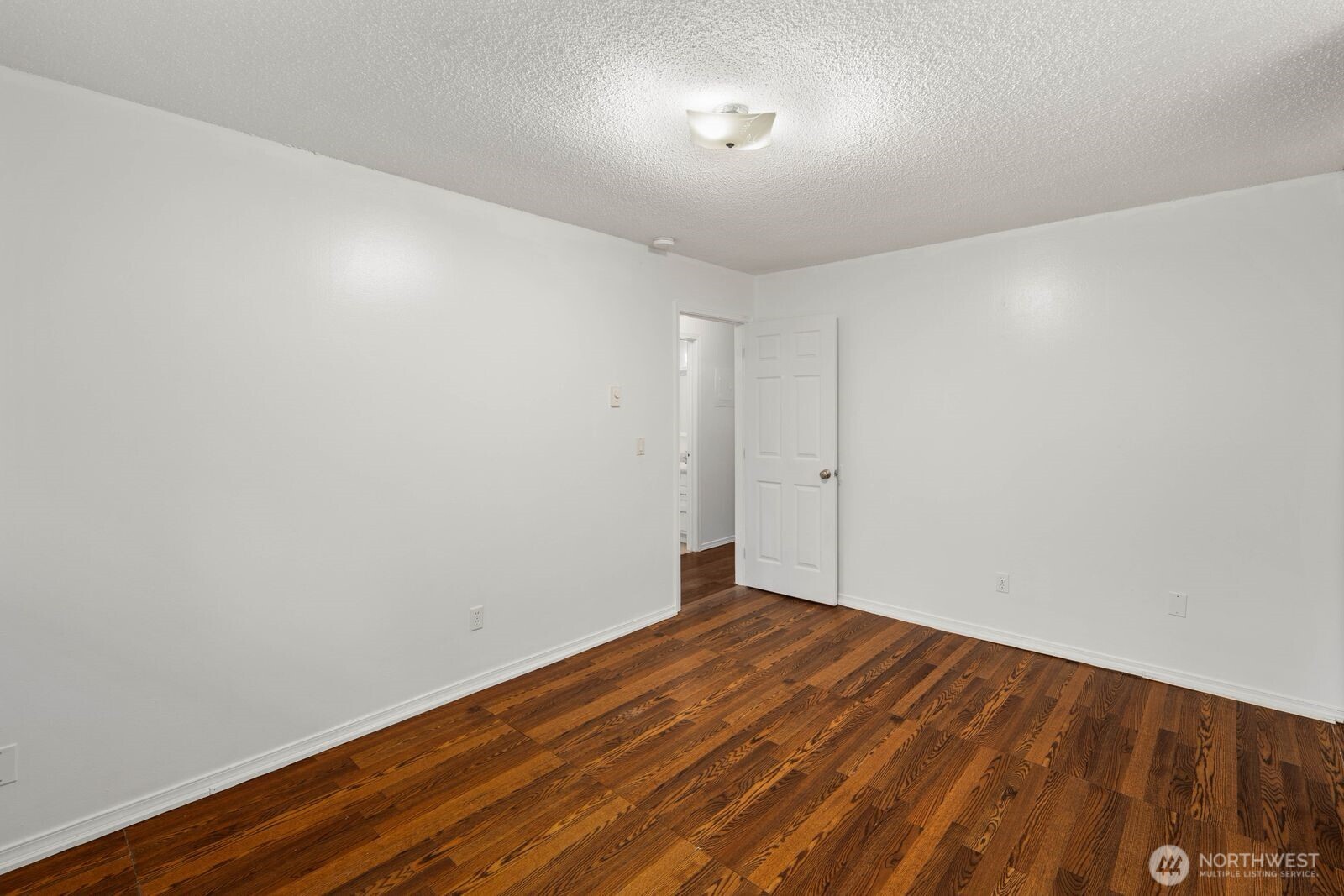 9623 South 248th Street, Unit C8 Kent, WA 98030 - Photo 20 of 37 a view of empty room with wooden floor