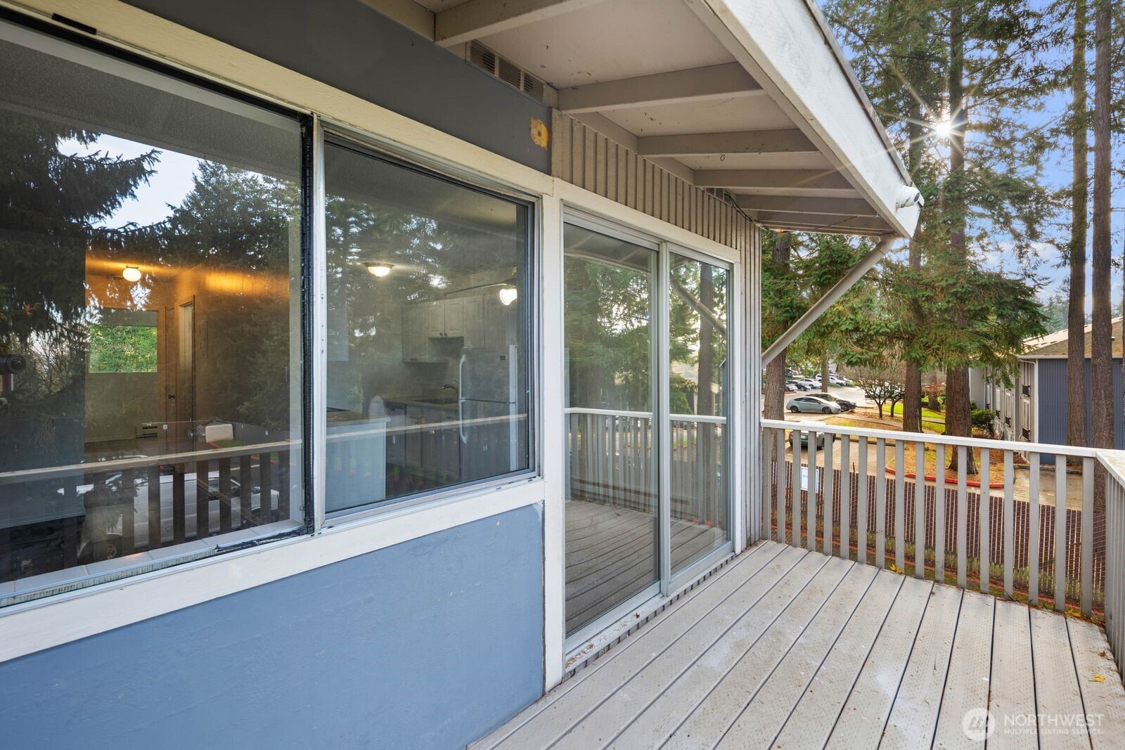 9623 South 248th Street, Unit C8 Kent, WA 98030 - Photo 24 of 37 a view of a balcony with wooden floor