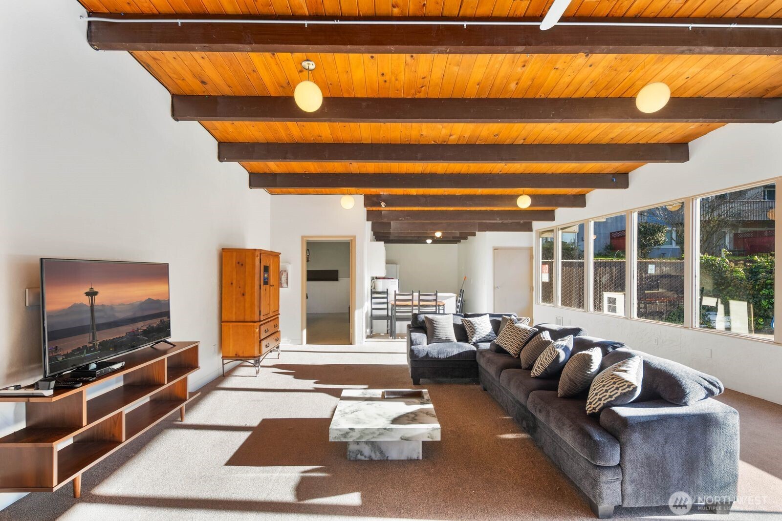 9623 South 248th Street, Unit C8 Kent, WA 98030 - Photo 25 of 37 a living room with furniture and a flat screen tv