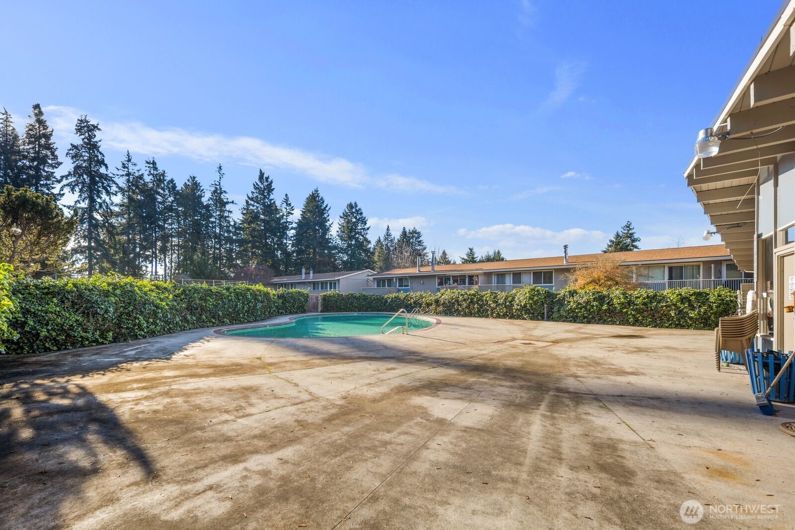 9623 South 248th Street, Unit C8 Kent, WA 98030 - Photo 30 of 37 a view of road with grass and trees in the background