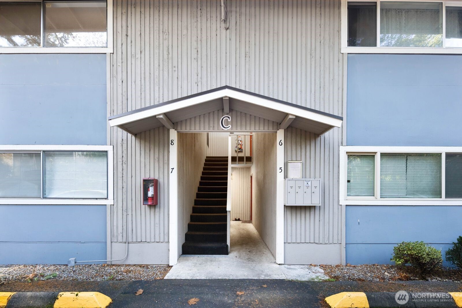 9623 South 248th Street, Unit C8 Kent, WA 98030 - Photo 33 of 37 a yellow house with a outdoor space