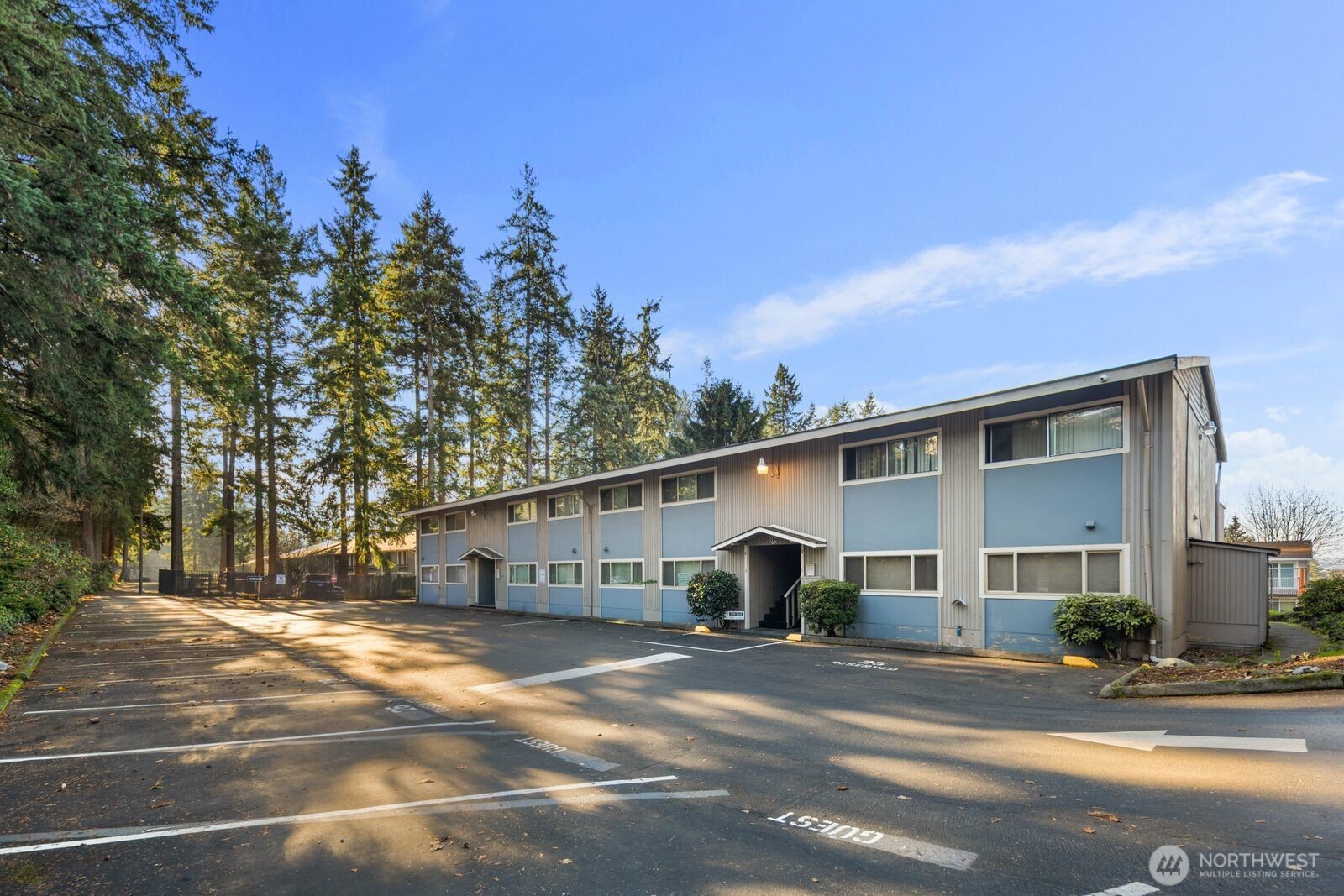 9623 South 248th Street, Unit C8 Kent, WA 98030 - Photo 34 of 37 a view of a white house with a street