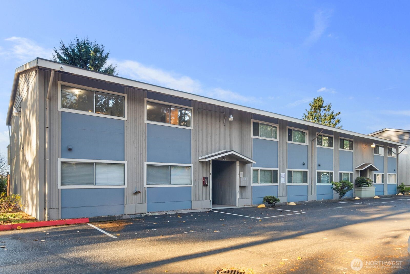 9623 South 248th Street, Unit C8 Kent, WA 98030 - Photo 37 of 37 a front view of a house with a yard