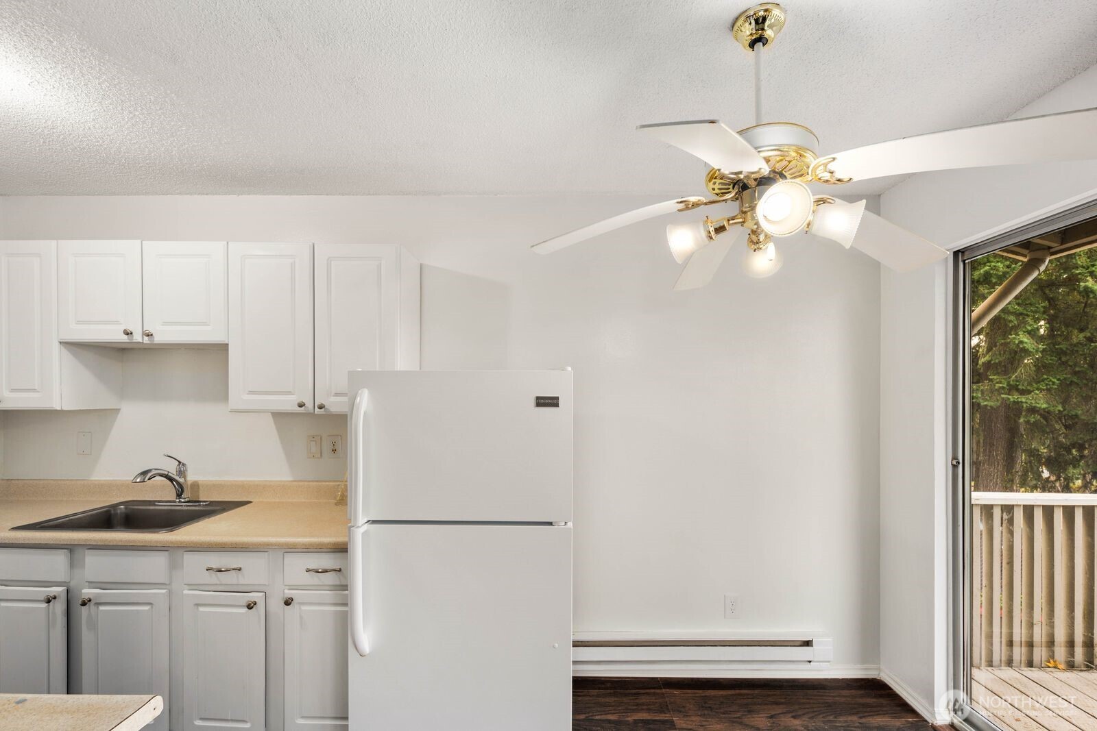 9623 South 248th Street, Unit C8 Kent, WA 98030 - Photo 5 of 37 a view of a kitchen with a sink and dishwasher a refrigerator with wooden floor