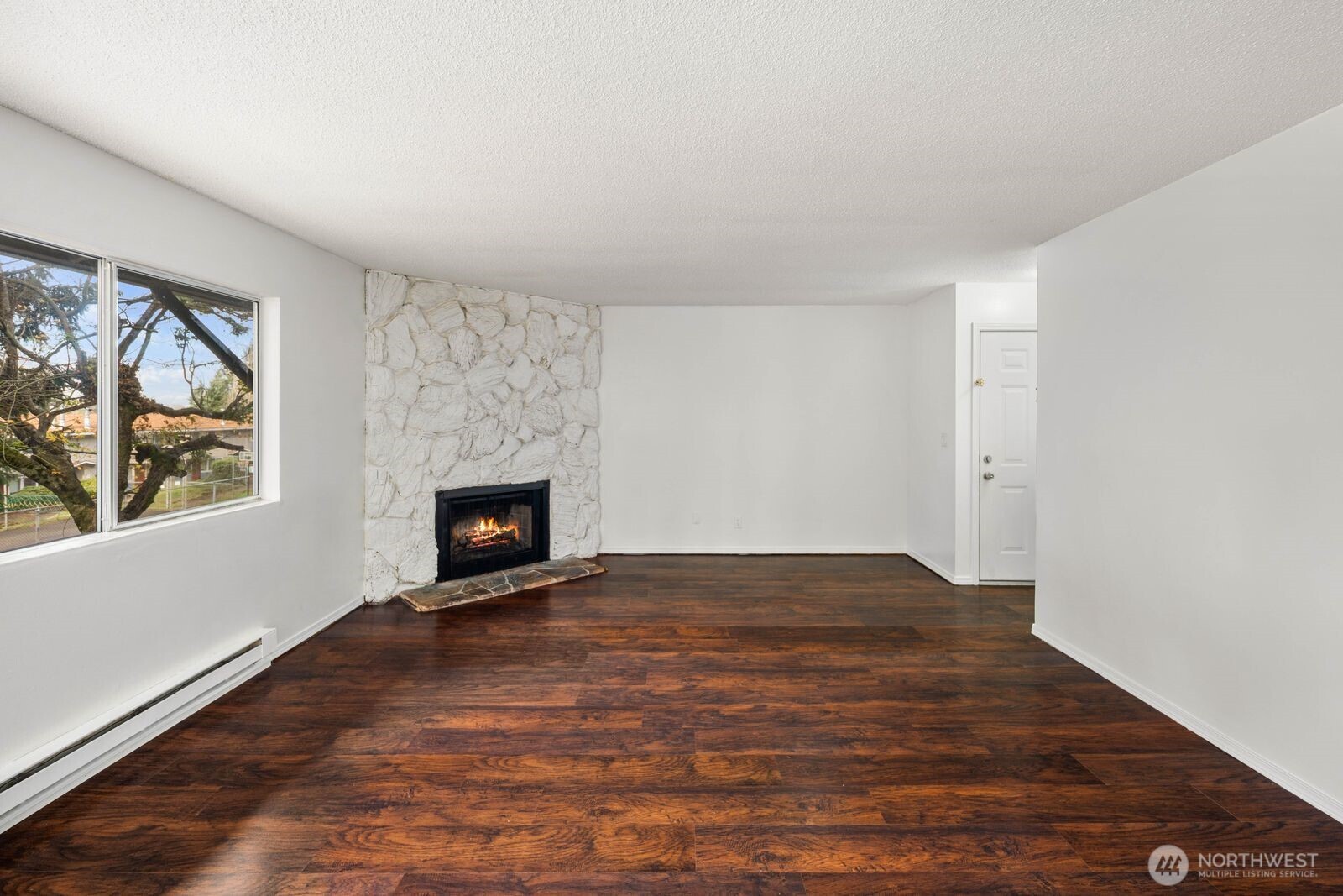 9623 South 248th Street, Unit C8 Kent, WA 98030 - Photo 10 of 37 a view of empty room with window and fireplace