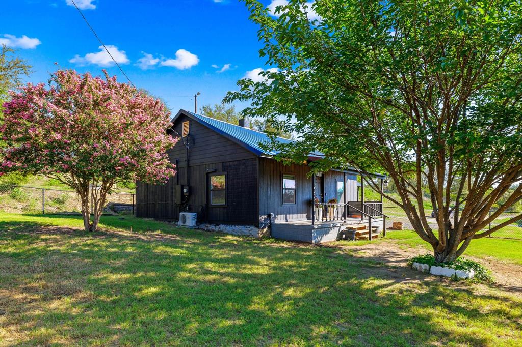 1550 South Stewart Street Azle, TX 76020 - Photo 2 of 35 a view of a house with a yard and tree s
