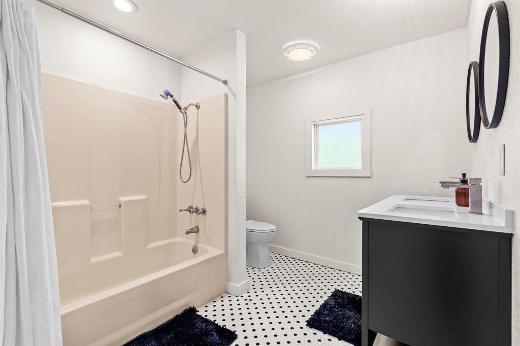1550 South Stewart Street Azle, TX 76020 - Photo 23 of 35 a bathroom with a sink a toilet and shower