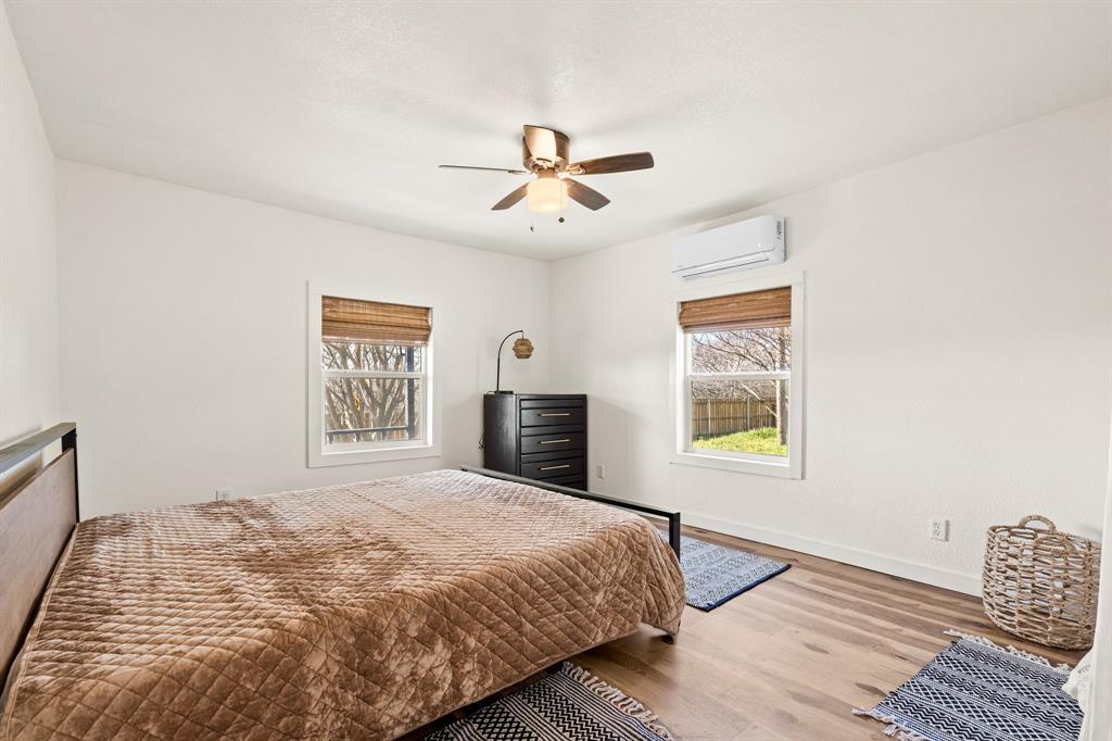 1550 South Stewart Street Azle, TX 76020 - Photo 30 of 35 a bedroom with a bed and a window