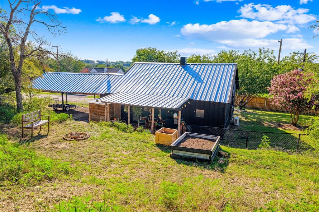 1550 South Stewart Street Azle, TX 76020 - Photo 35 of 35 a backyard of a house with table and chairs