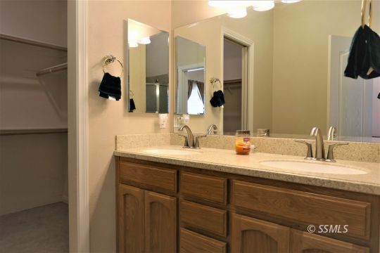 421 Mavis Court Ridgecrest, CA 93555 - Photo 21 of 33 a bathroom with a sink and a mirror